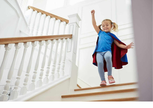 Australian Building Code for Stairs: NCC Compliance Guide - child playing on stairs with safety features.