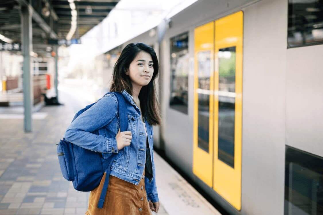 The Importance of Non-Slip Coatings: Reducing Slips and Falls in Public Transport - young woman at train station.