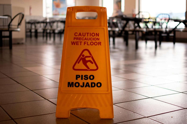 Slip Resistance Inspection Services: The Complete Australian Guide - caution wet floor sign in public area.