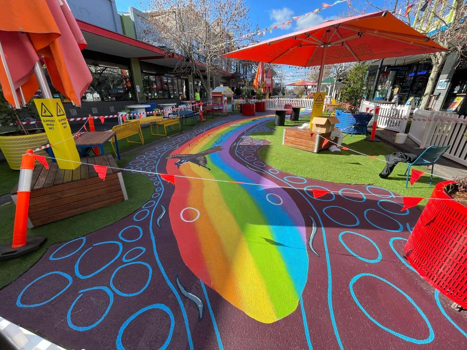 Stellmann Wins Tender To Seal Rainbow Serpent Mural Artwork For Stockland non-slip coating solution for outdoor pop-up parks in Point Cook.