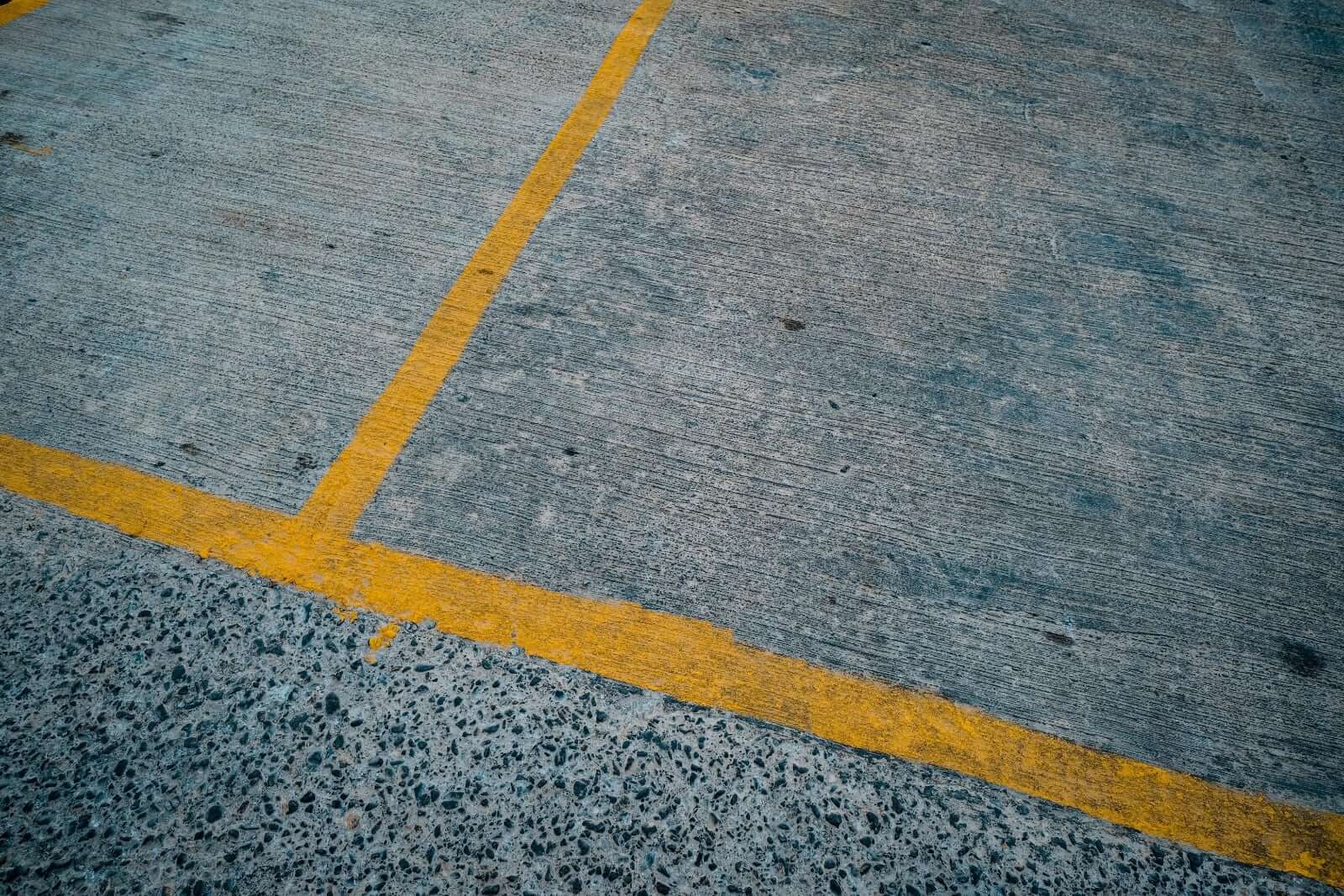 How to Choose the Right Commercial Line Marking Paint for Your Facility - yellow line marking on pavement