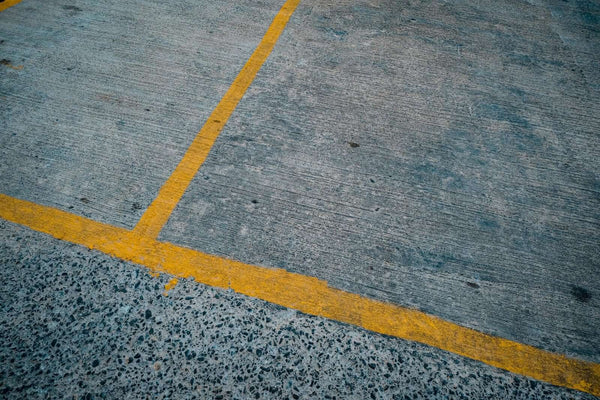 How to Choose the Right Commercial Line Marking Paint for Your Facility - yellow line marking on pavement