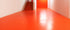 Indoor commercial space with bright red Stellmann non-slip coating for safety and visual demarcation in wet areas