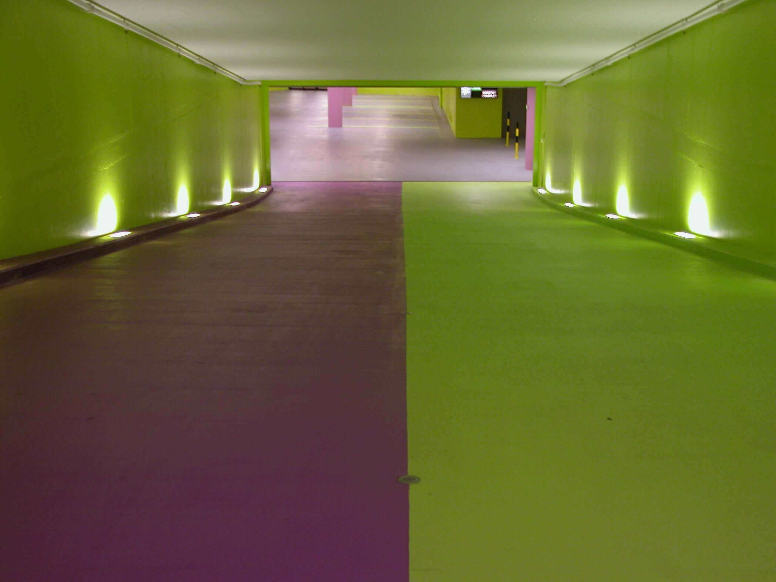 Indoor ramp with contrasting purple and green Stellmann non-slip coatings for visual guidance and safe directional flow