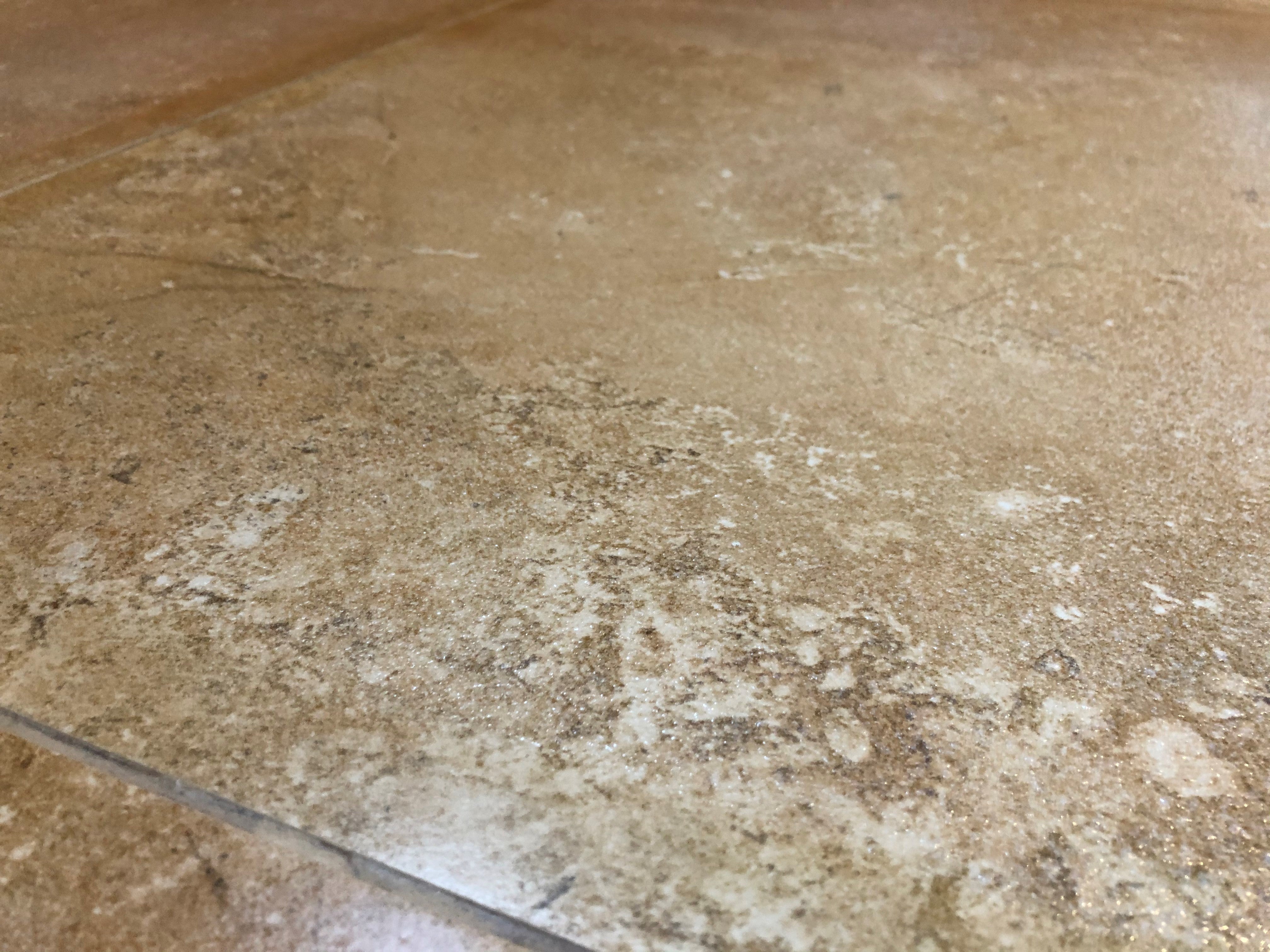 Textured brown marble tile coated with Stellmann non-slip clear treatment – P4 slip rating for wet indoor areas like kitchens and hallways