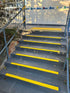 Outdoor stairs treated with Stellmann yellow anti-slip strips and tactile indicators for increased visibility, AS 1428.1 compliance and slip prevention