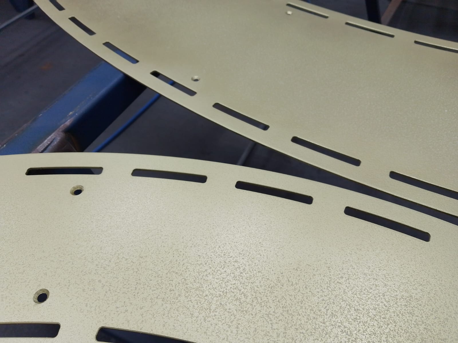 Close-up of brass surface coated with Stellmann clear anti-slip treatment – industrial-grade, transparent P4-rated finish for wet, metallic floors and ramps