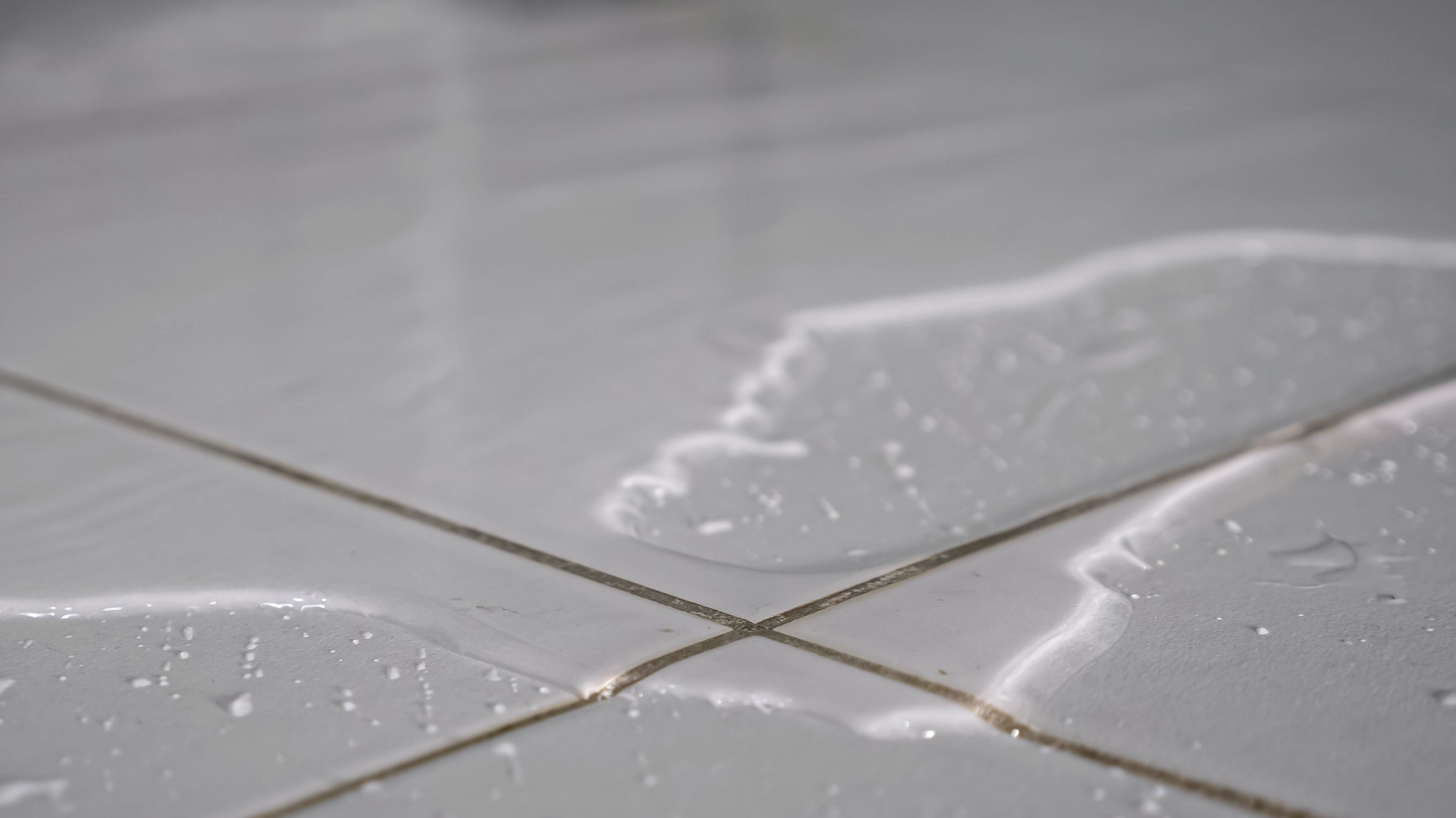 Slippery wet tiles before anti-slip coating – a hidden hazard in bathrooms, kitchens, and entryways